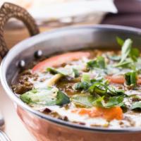 Swad's Dal Makhani · Slow cooked black lentils with spices, fresh ginger, garlic and tomatoes.