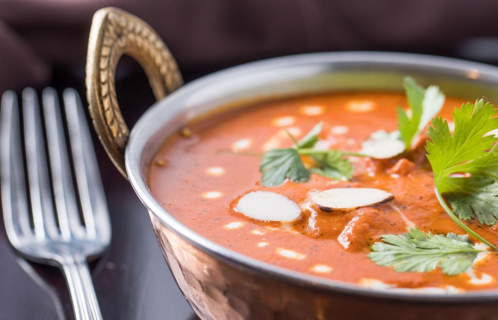 Butter Chicken · Shredded tandoori chicken cooked in luscious gravy flavored with fenugreek and homemade spices.