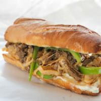 The Philly Steak Sandwich with Jalapeños · Mouthwatering sandwich made with tiny strips of steak, jalapeños, and topped with melted che...