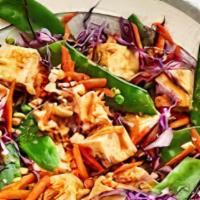Tofu Salad · Tofu tossed with red and white cabbage, pickled carrots, daikon, celery, cilantro, and onion...