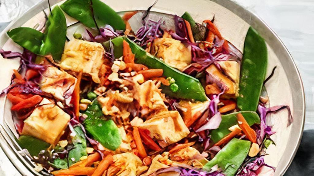Tofu Salad · Tofu tossed with red and white cabbage, pickled carrots, daikon, celery, cilantro, and onions in our house dressing.