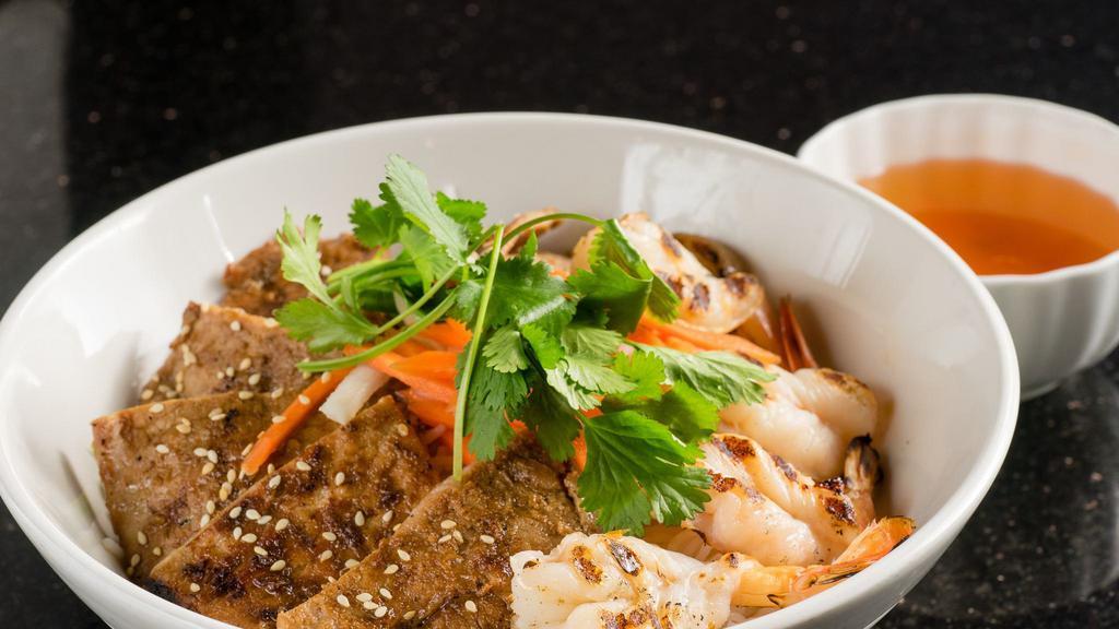 Vermicelli Bowl #9 · Spicy. Choice of marinated grilled beef, pork or chicken with 4 grilled prawns over vermicelli.