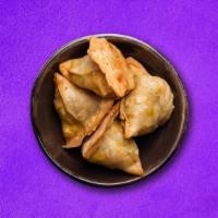 Super Samosa (Vegan) · Fried Pastry with loaded Filling of potato and peas usually served with chutney.