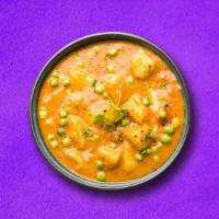  Potato In Peas (Vegan) · Potato and peas cooked together with onion, tomato and tossed with spices.