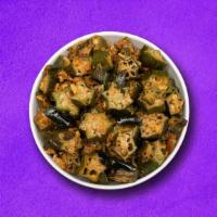 Outstanding Okra  (Vegan) · Okra sauteed and cooked with spices and herbs with fried onion and garlic.