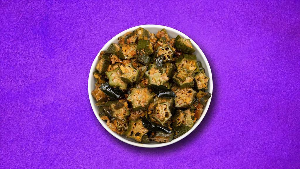 Outstanding Okra  (Vegan) · Okra sauteed and cooked with spices and herbs with fried onion and garlic.