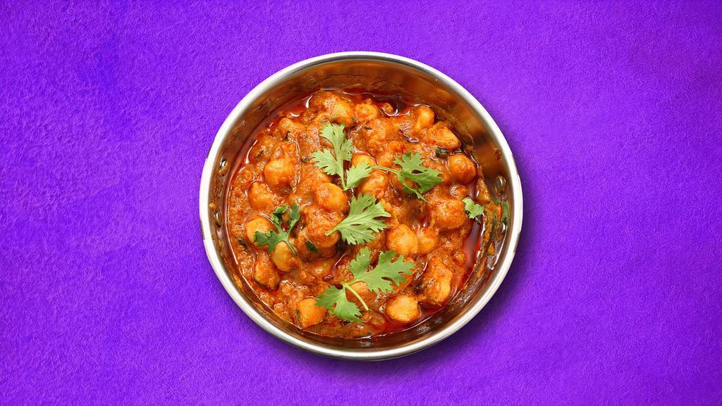 Gusto Garbanzo (Vegan)  · Chickpeas, boiled and simmered to perfection in a gently spiced onion & tomato curry