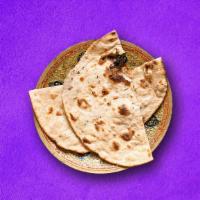 Classic Roti (Vegan) · Whole wheat flatbread grilled in Indian clay over and served with entress.