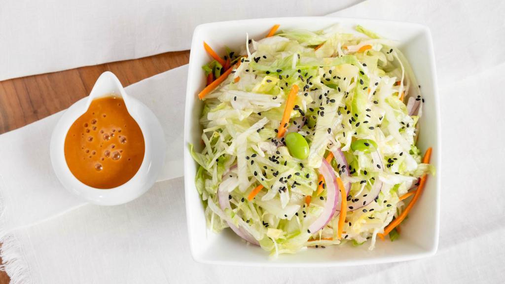 Fresh Mix Salad (Side) · Shredded lettuce, shredded cabbage, julienne carrots, julienne onions, edamame beans, and toasted black sesame, and our house made dressing.
