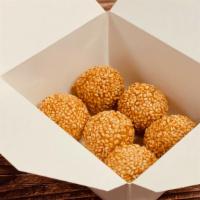 Mini Sesame Ball (6) · Made from glutinous rice flour. The pastry is coated with sesame seeds on the outside, red b...
