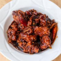 General Tso Chicken / 左宗鸡 · Deep-fried mixed in our delicious sweet and spicy brown sauce.