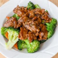Broccoli Beef / 西兰牛 · Beef, broccoli and garlic stir-fried in our flavorful brown sauce.
