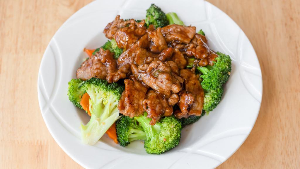 Broccoli Beef / 西兰牛 · Beef, broccoli and garlic stir-fried in our flavorful brown sauce.