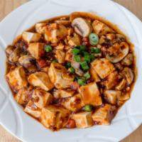 Ma Po Tofu (Soft) / 麻婆豆腐 · Soft tofu, mushrooms, peas and carrots cooked in peppercorn sauce.