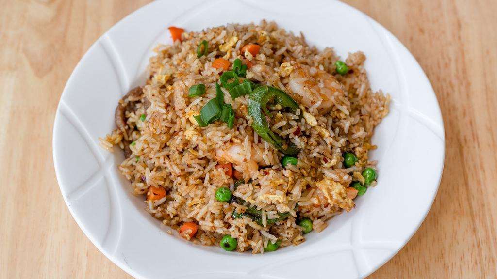 House Spicy Fried Rice / 麻辣炒饭 · A combination of shrimp, beef and chicken fried rice stir-fried with eggs, peppercorn powder, jalapeños, green onions, peas and carrots.