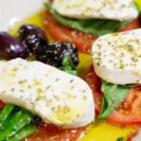 Mozzarella Di Bufala · Sliced fresh mozzarella cheese, sliced tomatoes, kalamata olives, olive oil & oregano served...