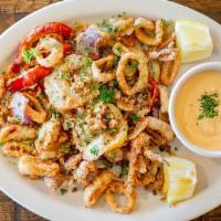 *Calamari Fritti · Lightly battered fried calamari (squid) sautéed with garlic & topped with fresh parsley serv...