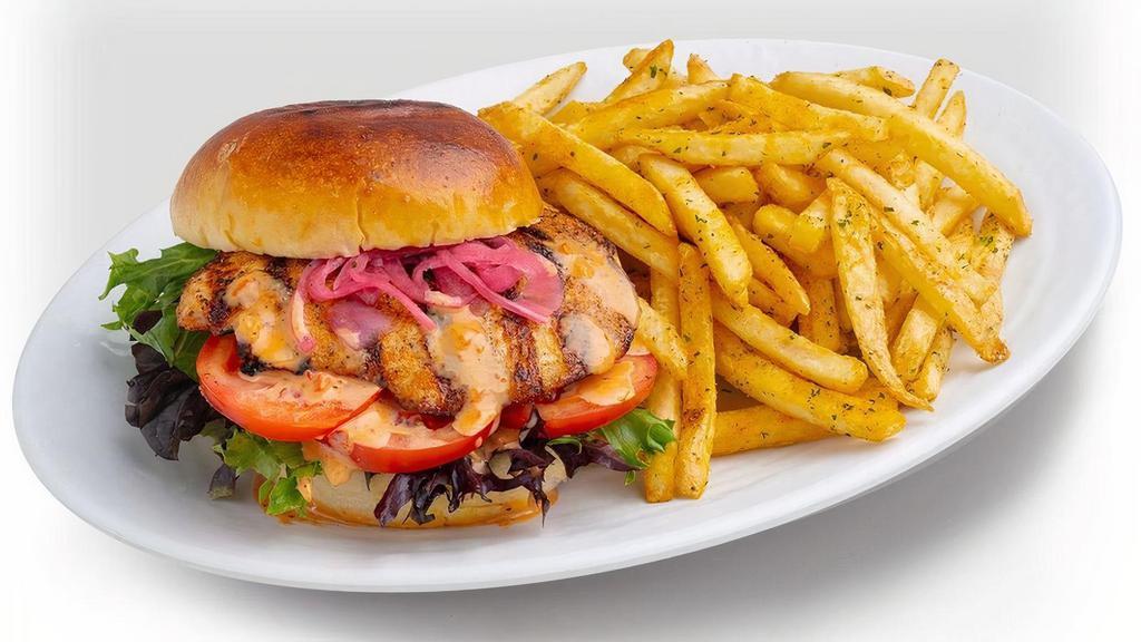 Grille Chicken Sandwich · Grilled Brioche Bun, Mixed Greens, Tartar Sauce & Dynamite Sauce, Tomatoes, Pickled Onions. Accompanied with choice of side.