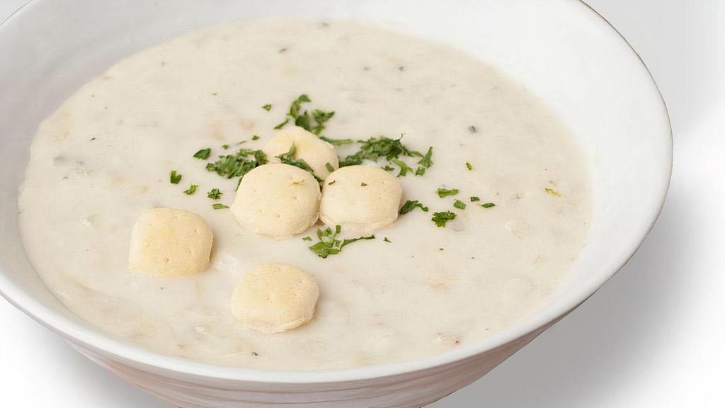 New England Clam Chowder · Our version of an east coast tradition is a creamy, rich chowder, with tender clams and hearty potatoes, served with oyster crackers