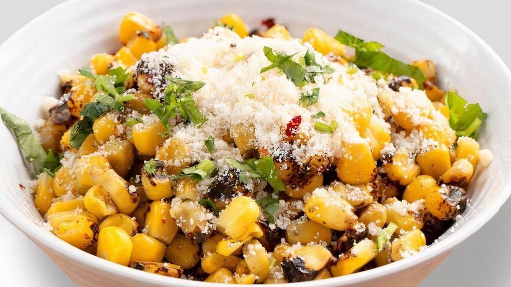 Fire Roasted Street Corn · Delicious charred sweet corn with chili flakes, garlic butter, parmesan cheese and cilantro.  So hard to resist, why try?