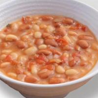 Beans · Slow simmered white and pinto beans, seasoned with cilantro and Spanish onion.
