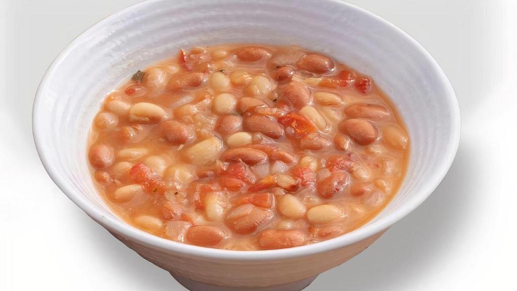 Beans · Slow simmered white and pinto beans, seasoned with cilantro and Spanish onion.