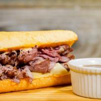French Dip · Thinly Sliced Roast Beef, House Spread, Swiss Cheese, and All-Natural Au Jus.