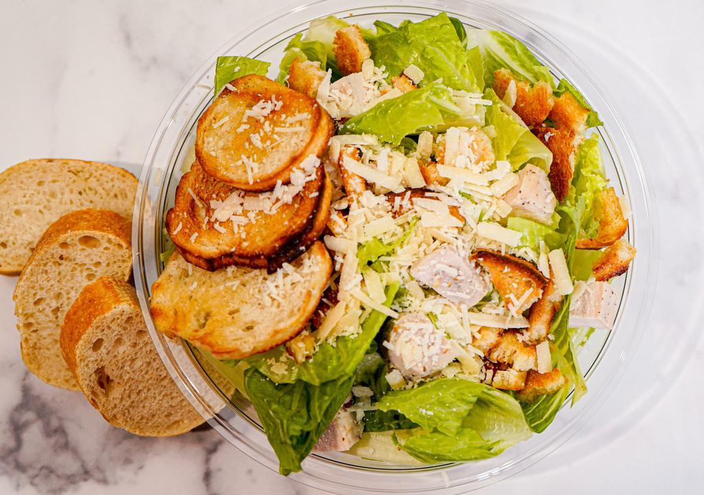 Grilled Chicken Caesar Salad · Chopped romaine, shaved parmesan, grilled chicken, sourdough croutons and caesar dressing.