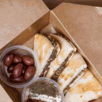 Zaatar Brunch · Enjoy a traditional lebanese breakfast with our zataar and pita bread. Comes with a lebne dr...