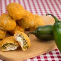 Jalapeño Poppers · Six pieces of jalapeños stuffed with cheddar cheese and served with a ranch dressing.