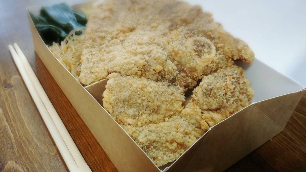 11. Fried Pork Chop · Our famous fried pork chop rice box has yummy fried pork chop as the main item.  We actually cut the pork chop into pieces for easy handling.