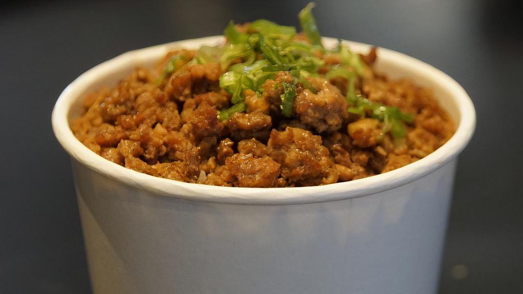 57. Braised Meat Rice Cup · Popular
Steamed rice topped with house braised pork and some green onion garnish in a 12 oz cup. A simple and famous day-to-day food in Taiwan.