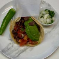 Super Taco · Corn tortillas, meat choice, beans, cheese, fresh salsa, and avocado.