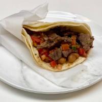 Taco · Corn tortillas, meat choice, beans, and fresh salsa.