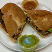 Torta · Choice of meat with sour cream, tomatoes, onions, and avocado.