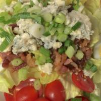 Papillon's Cobb Salad · Hearts of romaine, tomatoes, bacon, boiled egg, blue cheese and vinaigrette