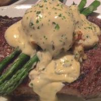 Grilled Angus Ribeye · In Marinade of olive oil, roasted peppers, basil, and roasted garlic purée served with steak...
