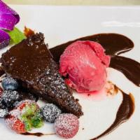 Flourless Chocolate Torte with Chocolate Ganache & Raspberry Coulis · 