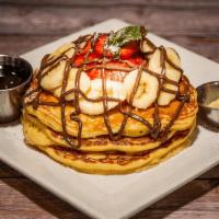 Strawberry Pancakes · topped with powdered sugar, side syrup. 🅥=Vegetarian