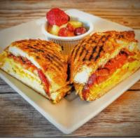 Croissant Sandwich · scrambled eggs with pinch of S&P, tomato, bacon, cheddar cheese, side of fruit.