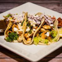 Chicken Tacos · grilled chicken, avocado, vegan cabbage slaw, fresh white cheese, guasacaca, corn tortilla, ...