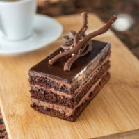 Chocolate Truffle · Chocolate devils food cake filled with a decadent ganache filling and topped with a truffle ...