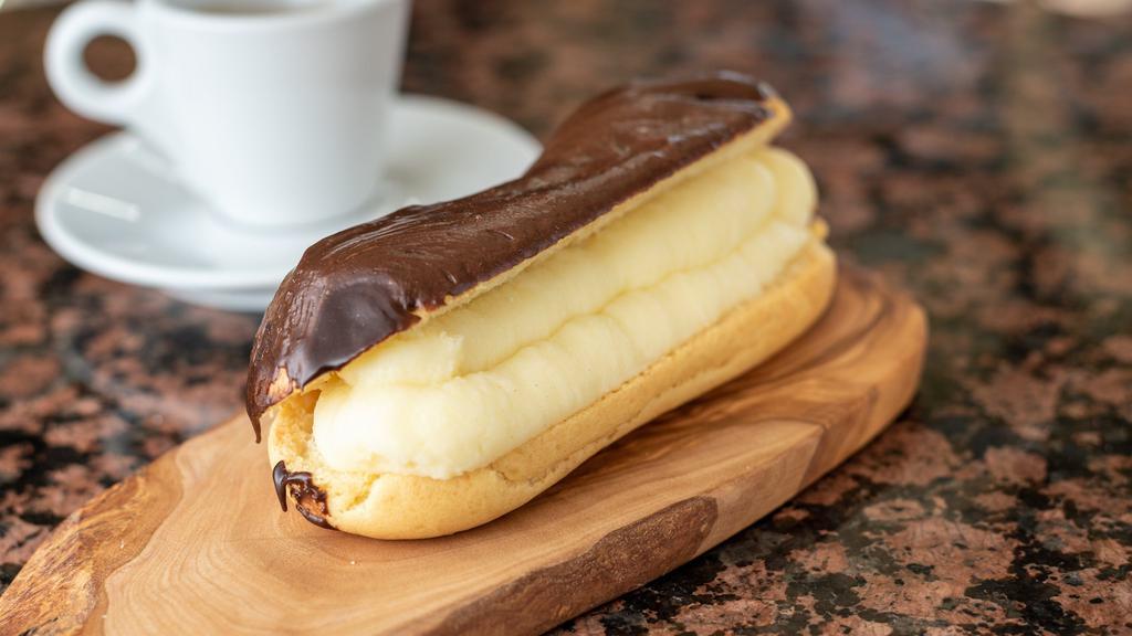 Chocolate Éclair · Old fashioned éclair filled with fresh whipped cream or custard topped with a rich chocolate glaze.
