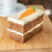 Carrot Cake · Super moist carrot layers filled with a rich cream cheese icing. Contains nuts and raisins.