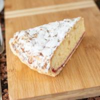 Almond tart slice · Delicious and moist almond cake with a puff pastry bottom topped with a thin layer of raspbe...