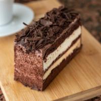 Fedora slice · Chocolate devils soaked with rum and filled with Italian pastry cream and fresh whipped crea...