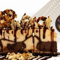 Cheesecake Challenge · NY-style cheesecake topped with salted potato chips, crushed pretzels & fudge sauce