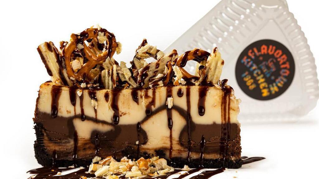 Cheesecake Challenge · NY-style cheesecake topped with salted potato chips, crushed pretzels & fudge sauce
