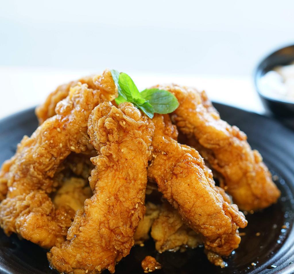 Chicken Strips · Korean style deep fried chicken strips. Accompanied with (2) sauces of your choice!