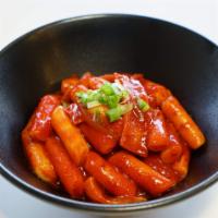 Dukkbokki · Spicy rice cake, smothered in dukbokki sauce.